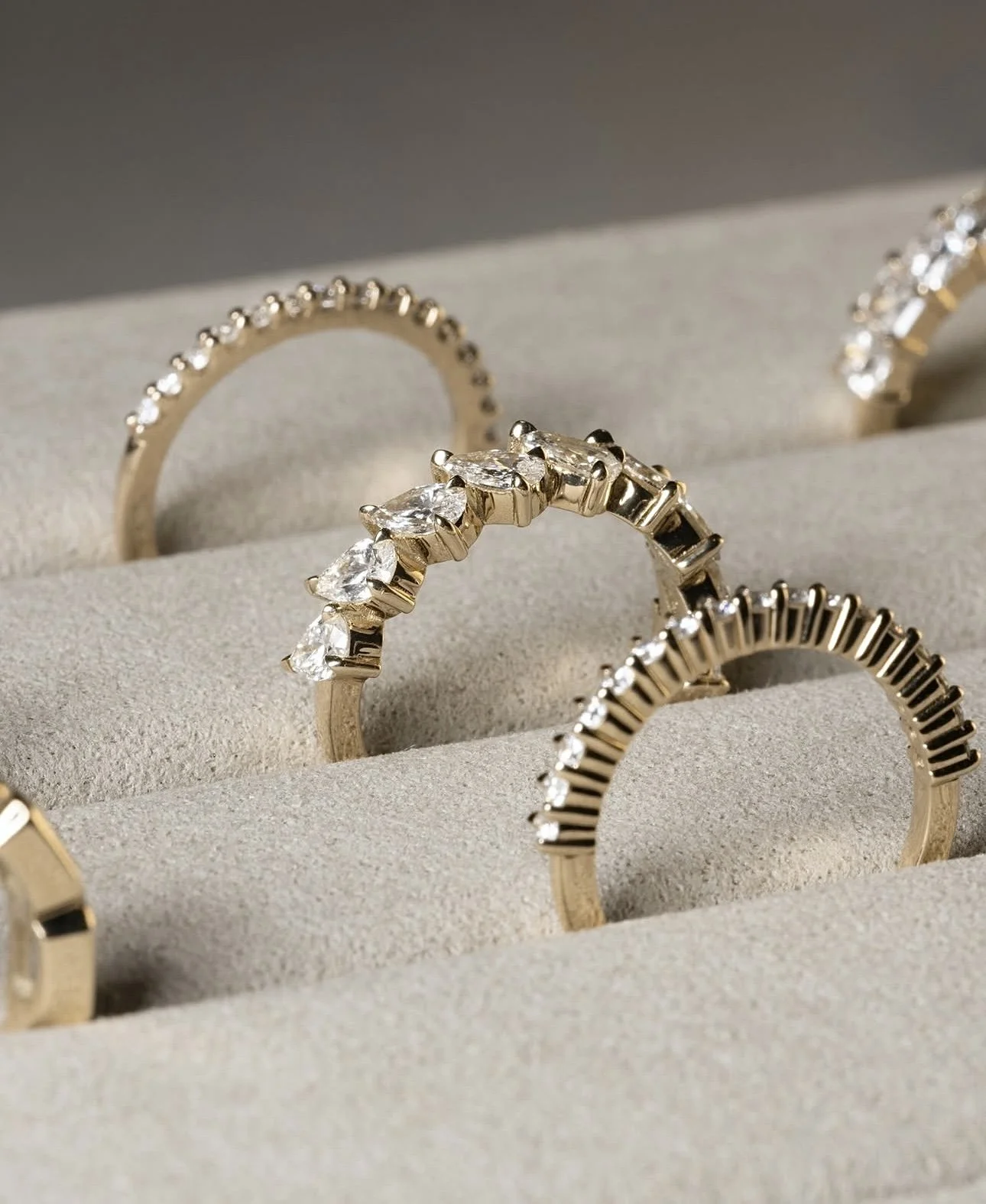 Diamond wedding bands displayed on linen